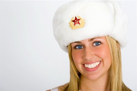 simsearch:400-04363188,k - A beautiful young Russian girl smiling and wearing a fur hat and shot in studio conditions Stock Photo - Budget Royalty-Free & Subscription, Code: 400-03955758