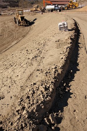 simsearch:400-06171776,k - Sandbags & Machinery at a Cunstruction Site and dirt lot. Stock Photo - Budget Royalty-Free & Subscription, Code: 400-03955926