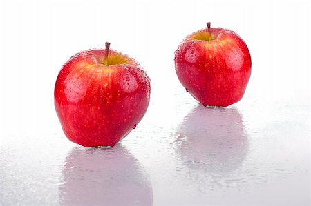 simsearch:400-04727937,k - Two bright red apples, with water drops, on white background. Stockbilder - Microstock & Abonnement, Bildnummer: 400-03956165