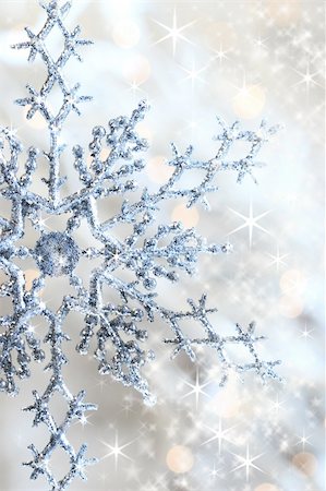 Closeup of snowflake with shimmering lights in background Stock Photo - Budget Royalty-Free & Subscription, Code: 400-03956740