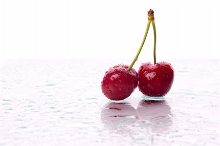 simsearch:700-00189706,k - Two cherries, with water droplets, with reflection. Landscape framing. Photographie de stock - Aubaine LD & Abonnement, Code: 400-03956819