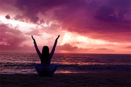 simsearch:400-03925229,k - Woman silhouette relaxing on the beach at the sunset Stock Photo - Budget Royalty-Free & Subscription, Code: 400-03956875