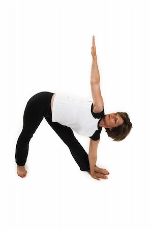 simsearch:400-04345817,k - woman in white t-shirt doing yoga pose over white BG Stockbilder - Microstock & Abonnement, Bildnummer: 400-03957158