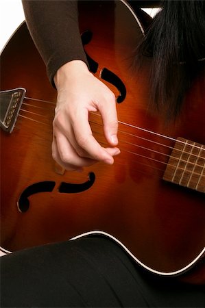 simsearch:400-03972483,k - Hands melodically strumming an acoustic guitar Stock Photo - Budget Royalty-Free & Subscription, Code: 400-03957233