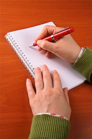 simsearch:632-03848077,k - Business woman writing on a blank paper Stockbilder - Microstock & Abonnement, Bildnummer: 400-03957533