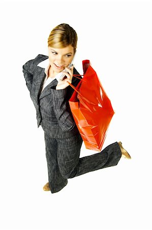 simsearch:400-04393054,k - Beautiful woman with shopping bags and cell phone isolated on white background Foto de stock - Super Valor sin royalties y Suscripción, Código: 400-03959905