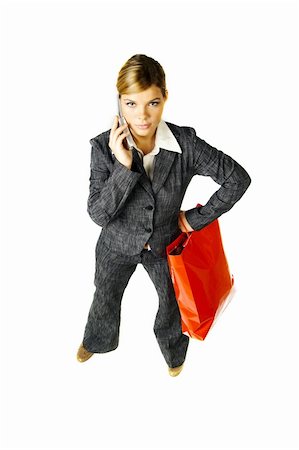 simsearch:400-04393054,k - Beautiful woman with shopping bags and cell phone isolated on white background Foto de stock - Super Valor sin royalties y Suscripción, Código: 400-03959903