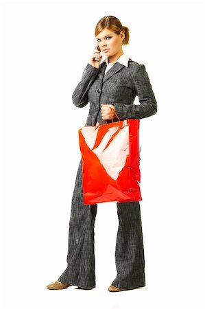 simsearch:400-04058311,k - Young business woman isolated on white background with shopping bag and cell phone Foto de stock - Super Valor sin royalties y Suscripción, Código: 400-03959913