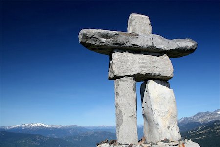 simsearch:400-05175536,k - A stone figure wecomes tourists and visitors to the resort municipality of Whistler, BC.  This figure is also the symbol of the 2010 winter olympics. Fotografie stock - Microstock e Abbonamento, Codice: 400-03950098