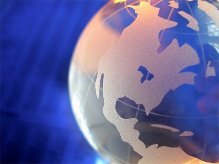 macro of a glass globe in front of business figures, with focus on north and central america Foto de stock - Super Valor sin royalties y Suscripción, Código: 400-03950157