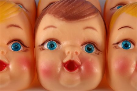 simsearch:400-03945849,k - A close up of plastic doll faces ready for assembly into toys Foto de stock - Royalty-Free Super Valor e Assinatura, Número: 400-03950651