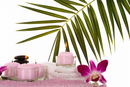 Orchids, towel, candles, pebbles and aromatic bath salt in a spa Stock Photo - Budget Royalty-Free & Subscription, Code: 400-03950758