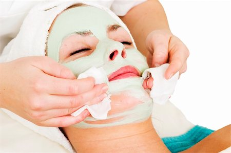 simsearch:400-03951218,k - Detail of a facial mask treatment being wiped off the face. Foto de stock - Royalty-Free Super Valor e Assinatura, Número: 400-03951199