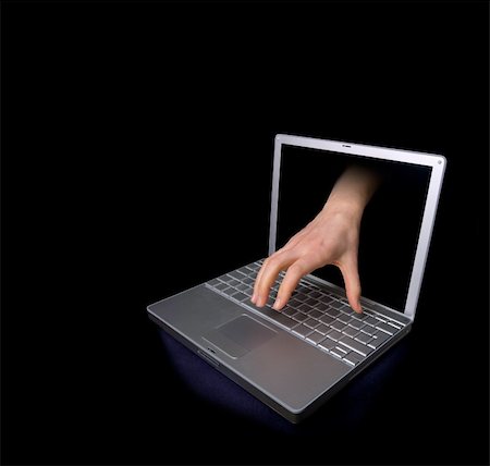 simsearch:649-08765890,k - A hacker concept image of a hand coming through the computer. Photographie de stock - Aubaine LD & Abonnement, Code: 400-03951383