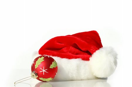 simsearch:400-05180053,k - Santa hat with red christmas ball isolated on white background Stockbilder - Microstock & Abonnement, Bildnummer: 400-03951630