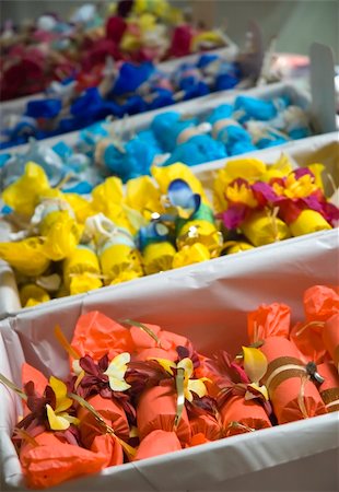 Colorful Bon-bons or Christmas crackers being sold on Christmas gift market. Stockbilder - Microstock & Abonnement, Bildnummer: 400-03951738
