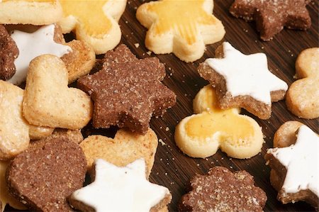 Christmas cookies scattered on a wood table. Stock Photo - Budget Royalty-Free & Subscription, Code: 400-03952749