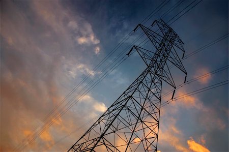 electricity pylon cables red - Silhouettes of power lines and a tower with a brilliant sunset Stock Photo - Budget Royalty-Free & Subscription, Code: 400-03953009