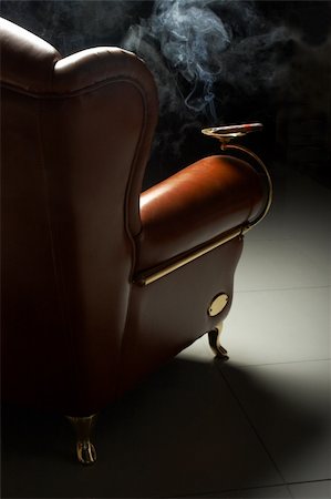 simsearch:400-05292494,k - Cigar and beautiful leather armchair on marble to a floor Stock Photo - Budget Royalty-Free & Subscription, Code: 400-03953259