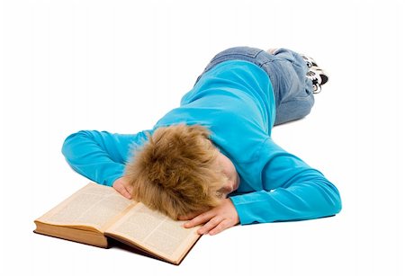 *** note for inspectors: the book is very old (1915), the text in the book is even older (~1830) thus no copyright issue with recognizable text***  Tired teenager boy fallen asleep on his book; isolated on white Photographie de stock - Aubaine LD & Abonnement, Code: 400-03953677