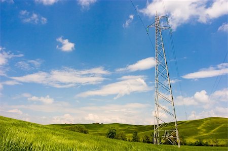 electricity pole silhouette - Powerline on a wide green field. Environment care. Foto de stock - Super Valor sin royalties y Suscripción, Código: 400-03964167