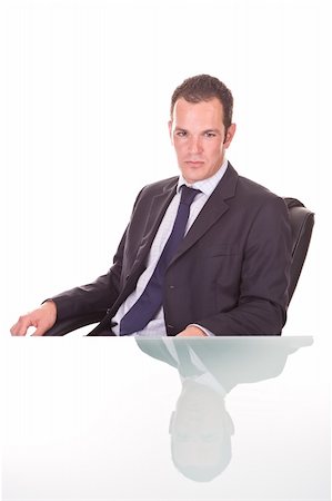 simsearch:400-03916433,k - Handsome young confident businessman. On a glass desk, Isolated on white. Foto de stock - Super Valor sin royalties y Suscripción, Código: 400-03964319