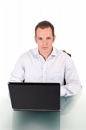 simsearch:400-03916433,k - A young handsome man working on a laptop. Foto de stock - Super Valor sin royalties y Suscripción, Código: 400-03964324