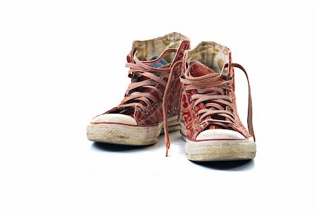 A pair of old sneakers, isolated on white background. Foto de stock - Super Valor sin royalties y Suscripción, Código: 400-03964332