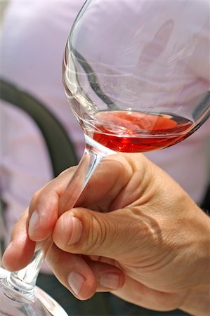 simsearch:400-03966426,k - youn man is drinking out of a glass of rose wine Fotografie stock - Microstock e Abbonamento, Codice: 400-03964357