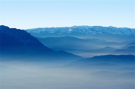 simsearch:696-03397638,k - View of a valley and blue mountains in the fog Stock Photo - Budget Royalty-Free & Subscription, Code: 400-03964501