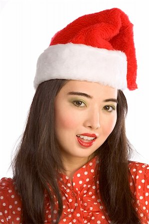 simsearch:632-06118640,k - Portrait of young Asian female in Santa hat Photographie de stock - Aubaine LD & Abonnement, Code: 400-03964522