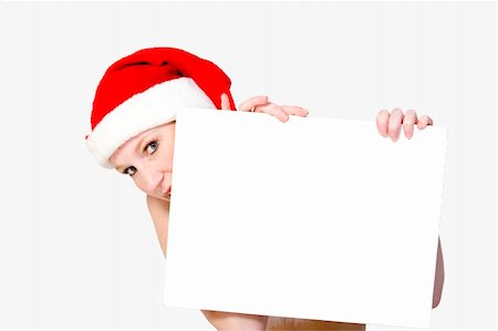 simsearch:693-07444529,k - Beautifull girl in christmas bikini and with christmas hat is hlding up a white sign for copy space. With background clipping path for your convenience Stock Photo - Budget Royalty-Free & Subscription, Code: 400-03964545