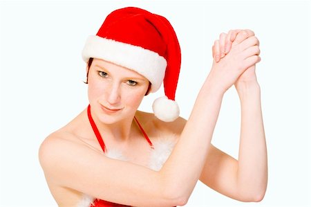 Beautifull girl in christmas bikini and christmas hat celebrating. With background clipping path for your convenience Stock Photo - Budget Royalty-Free & Subscription, Code: 400-03964542