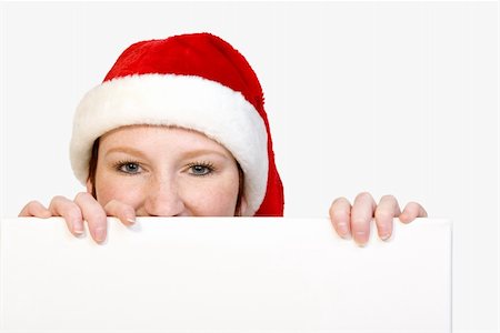 simsearch:400-03944827,k - Beautifull girl in christmas bikini and with christmas hat is hlding up a white sign for copy space. With background clipping path for your convenience Foto de stock - Super Valor sin royalties y Suscripción, Código: 400-03964552