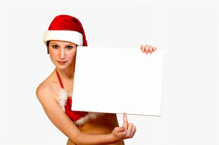 simsearch:693-07455915,k - Beautifull girl in christmas bikini and with christmas hat is hlding up a white sign for copy space. With background clipping path for your convenience Photographie de stock - Aubaine LD & Abonnement, Code: 400-03964700