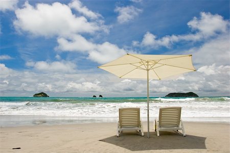 simsearch:700-03075665,k - Two chairs and umbrella at the beach. Manuel Antonio, Costa Rica. Stock Photo - Budget Royalty-Free & Subscription, Code: 400-03964739