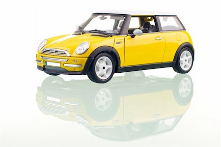 simsearch:400-04950760,k - Yellow car with reflection. Studio shot. Photographie de stock - Aubaine LD & Abonnement, Code: 400-03964757