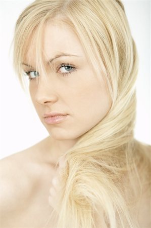 simsearch:6109-06195739,k - Portrait of Fresh and Beautiful young blond woman playing with her hair Foto de stock - Super Valor sin royalties y Suscripción, Código: 400-03964898