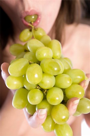 photo of model woman with grapes - A woman portrait taken in the studio Stock Photo - Budget Royalty-Free & Subscription, Code: 400-03965325
