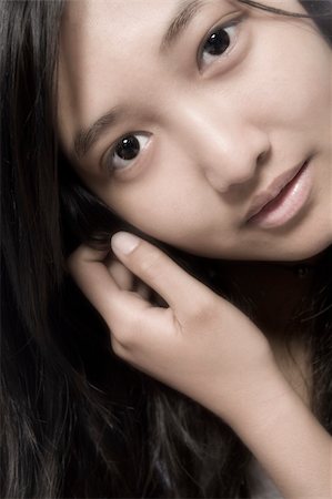portrait of a Asian model holding her hair back Photographie de stock - Aubaine LD & Abonnement, Code: 400-03965354