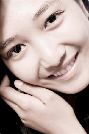 Portrait of an Asian girl smiling cute Stock Photo - Budget Royalty-Free & Subscription, Code: 400-03965356