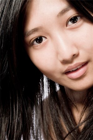 Portrait of an Beautyfull Asian model looking questionable Photographie de stock - Aubaine LD & Abonnement, Code: 400-03965362