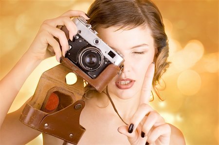 simsearch:400-03965676,k - a glamorous girl in the evening dress holding a camera Foto de stock - Super Valor sin royalties y Suscripción, Código: 400-03965642