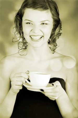 simsearch:400-03965656,k - glamorous girl having a cup of coffee Photographie de stock - Aubaine LD & Abonnement, Code: 400-03965653