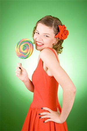 simsearch:400-03965656,k - girl in red with a rainbow lollipop Photographie de stock - Aubaine LD & Abonnement, Code: 400-03965676