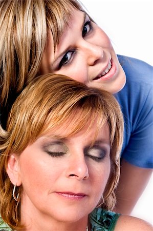 simsearch:400-03973423,k - A portrait taken from mother and daughter taken on a white background Foto de stock - Super Valor sin royalties y Suscripción, Código: 400-03965690