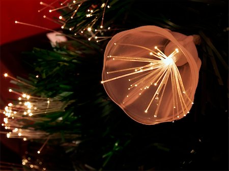 simsearch:400-04736001,k - Details of a fibre-optic decorated Christmas Tree against a red wall Foto de stock - Super Valor sin royalties y Suscripción, Código: 400-03965888