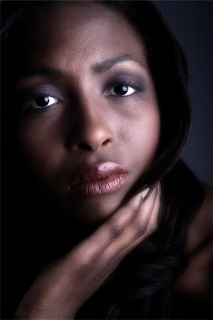 A beauty portrait taken from an african model in the studio looking serious Stock Photo - Budget Royalty-Free & Subscription, Code: 400-03966381