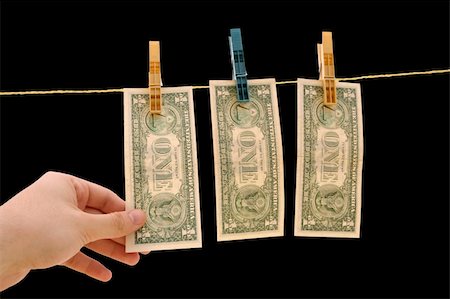 Dollars on the wire isolated on black Stock Photo - Budget Royalty-Free & Subscription, Code: 400-03966451