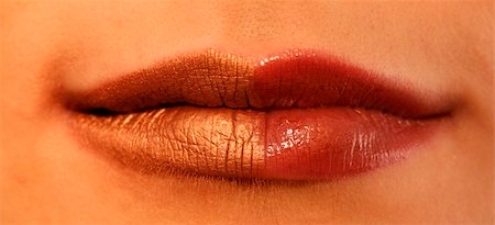 simsearch:649-07436631,k - Macro image of bright lips. Red and gold lipstik Stockbilder - Microstock & Abonnement, Bildnummer: 400-03966461